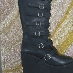 Buckle knee high platform wedge boots.